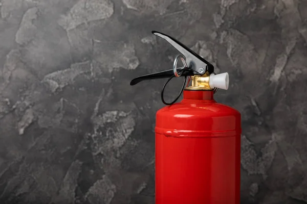 Stock image Fire extinguisher on a black marble background. Fire protection, home fire extinguisher. home security concept. Place for text. Copy space.banner