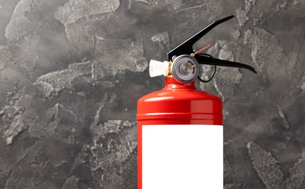 Fire extinguisher on black texture background. Fire protection, home fire extinguisher. home security concept. Place for text. Copy space.banner