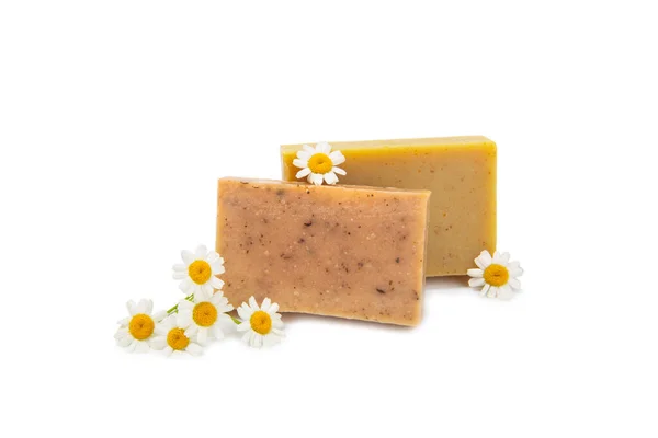 stock image Natural homemade soap with chamomile flowers isolated on a white background. Close-up of moisturizing soap with natural herbal oils. Spa and beauty concept.