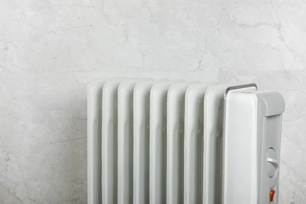 Different types of radiators. Heating systems store.Modern radiator at home. Central heating system. radiator, White radiator in the apartment.Expensive heating costs concept, close-up.Heating season.