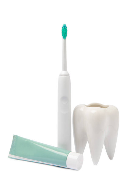 Electronic ultrasonic toothbrush, mouthwash, floss, tongue cleaner and toothpaste isolated on white background. Items for dental care and caries prevention in the bathroom. Dentistry concept