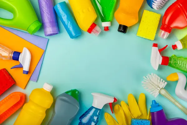 Cleaning service concept.Home cleaning product on a color background. Bucket with household chemicals. cleaning supplies for home or office space.Early spring regular cleaning. Copy space