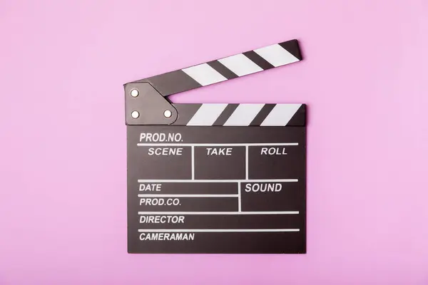 Movie clapper. Movie clapperboard on a bright colored background. Concept of rest and entertainment. Concept of cinema. Film director. Producer. Business and profession. Place for text. Copy space