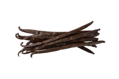 Beyaz arka planda izole edilmiş vanilya kabukları. Vanilya çiçekleri ve tohumlar. Vanilyalı fasulye. Hamur işleri ve tatlılar için baharatlı baharat. Baharat. Mesaj için yer var. Boşluğu Kopyala