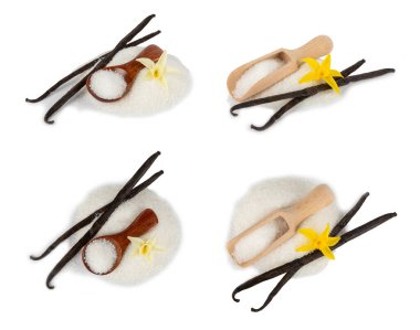 Aromatik vanilya şekeri. Vanilya kabukları. Vanilya çubukları, beyaz arka planda izole edilmiş kahverengi ve beyaz şeker. Vanilya çiçekleri, baharatlar ve tatlı ve pişirme için bitkiler. Mesaj için yer var. Boşluğu kopyala