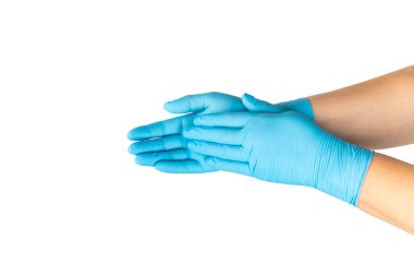 Beyaz arka planda izole edilmiş tıbbi nitril eldivenler. Cerrahi lateks eldivenler. Lastik eldiven üretimi. Doktor ya da hemşire koruyucu eldiven takıyor. Tıp konsepti. Kısırlık, koruma.