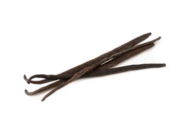 Beyaz arka planda izole edilmiş vanilya kabukları. Vanilya çiçekleri ve tohumlar. Vanilyalı fasulye. Hamur işleri ve tatlılar için baharatlı baharat. Baharat.