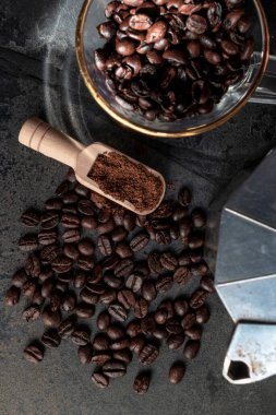 Roasted coffee bean on stone background copy space, top view, food and drink concept.