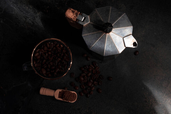 Roasted coffee bean on stone background copy space, top view, food and drink concept.
