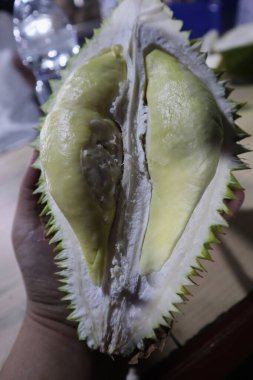 Top view of fresh yellow Durian fruit with blurred background