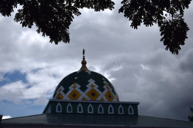 Islamic mosque and blue sky, perspective of mosque dome and lower angle view.