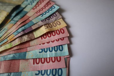 Indonesian rupiah banknotes in denominations isolated on white background