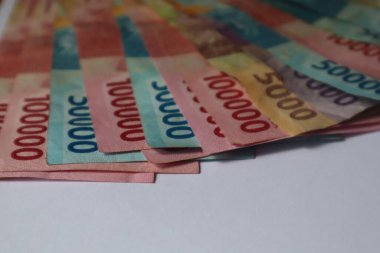 Indonesian rupiah banknotes in denominations isolated on white background