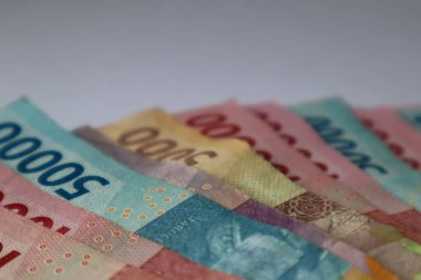 Indonesian rupiah banknotes in denominations isolated on white background