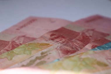 Indonesian rupiah banknotes in denominations isolated on white background