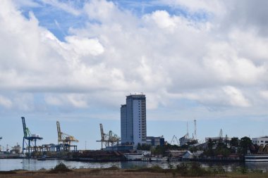 Perspective and lower angle view of the hotel building against the bright blue sky