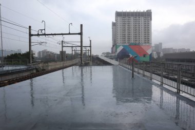 Perspective and lower angle view of the hotel building against the bright blue sky