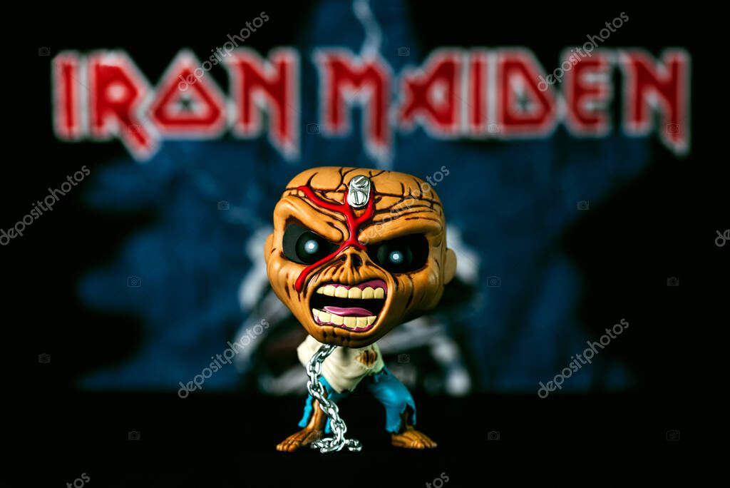 Funko POP vinyl figure of Piece of mind Eddie mascot of the British heavy metal band Iron Maiden in front of Iron Maiden poster. Illustrative editorial of Funko Pop action figure