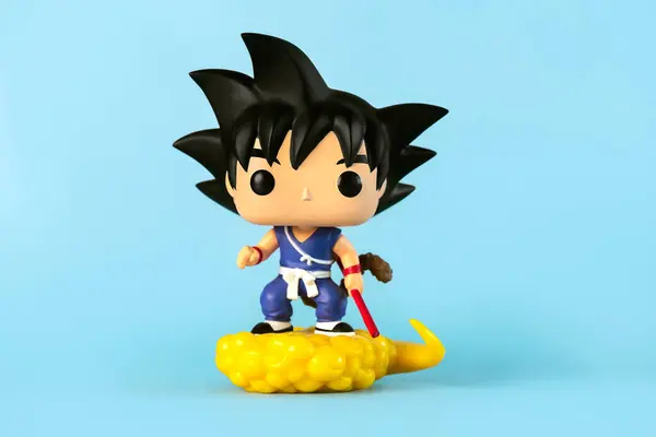 stock image Funko POP vinyl figure of Son Goku & Flying Nimbus character of the Dragon Ball Z manga series created by Akira Toriyama over blue background. Illustrative editoria