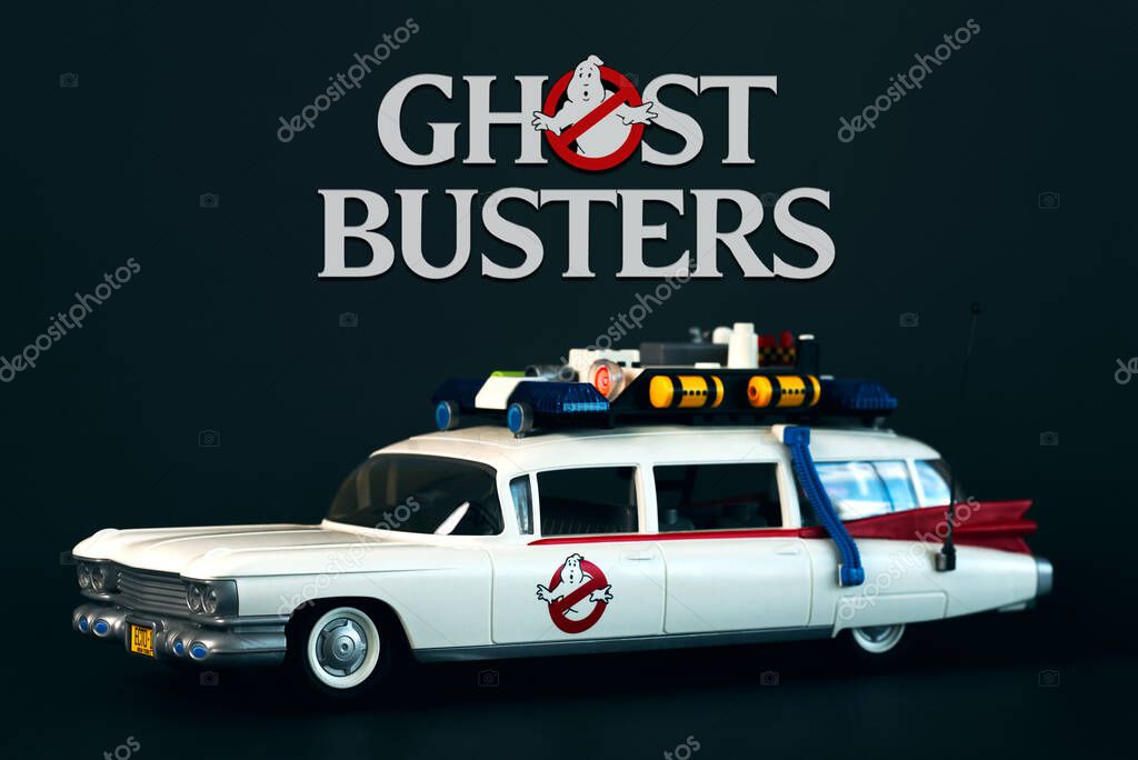 Playmobil car from the movie Ghostbusters with the Ghostbusters logo above over black background. Illustrative editorial