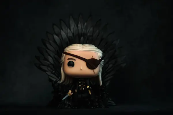 stock image Close-up of Funko POP vinyl figure of Aemond Targaryen on the iron throne character of the TV serie House of The Dragon. Illustrative editorial