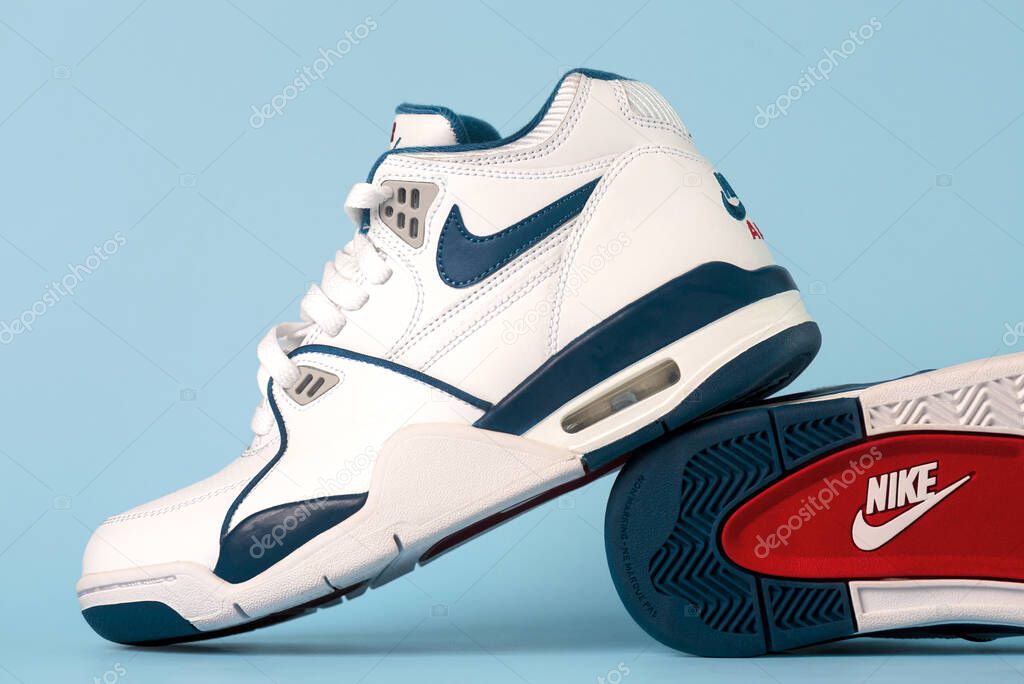 Closeup of Nike sport shoes Air Flight 89 over blue background. Illustrative editorial