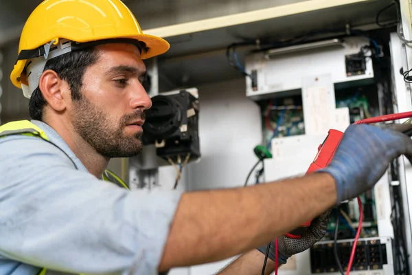 stock image Robotics engineer working on maintenance of modern robotic arm in factory warehouse