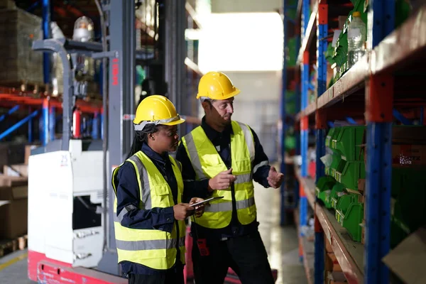 Workers at warehouse. Distribution, logistics concept
