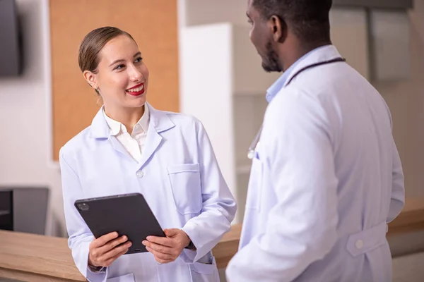 stock image Healthcare professionals discussing in hospital