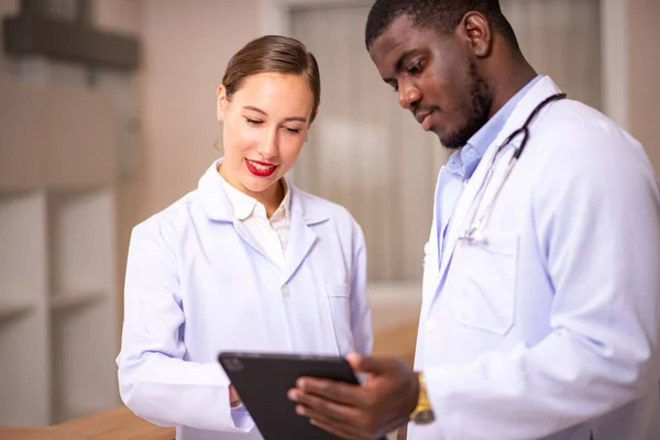 stock image Healthcare professionals discussing in hospital