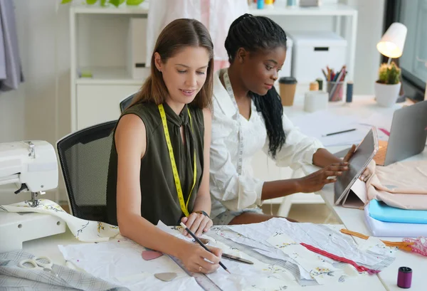 Stock image Fashion designers working together in their studio