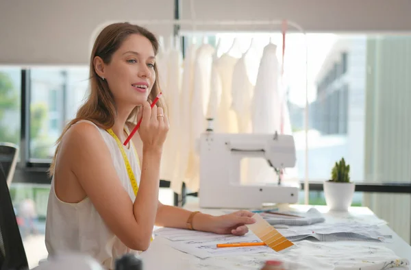young clothes designer in her studio
