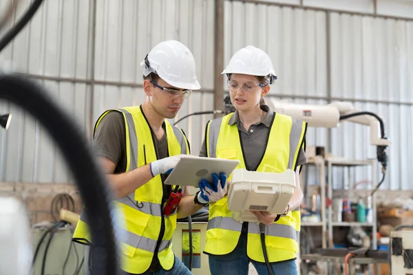 stock image Engineers working maintanence in factory warehouse