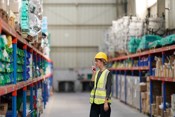 stock image Warehouse Industrial supply chain and Logistics Companies inside. Warehouse workers checking the inventory. Products on inventory shelves storage.