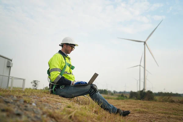 stock image Wind turbine service engineer maintenance and plan for inspection at construction site, renewable electricity generator