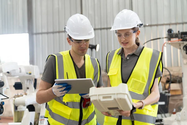 stock image workers  in  manufacturing factory, production engineering