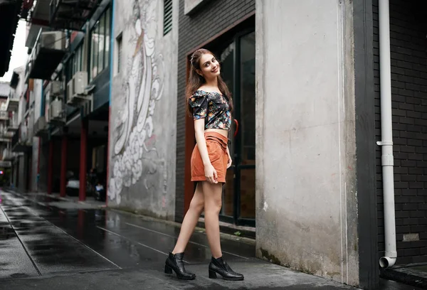 Fashion Model in street urban background. Beautiful Sexy business Woman In Stylish Fashionable miniskirt Clothes. posing outside the office.