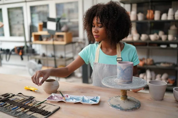 stock image Young Afro girl in pottery workshop, Business owner