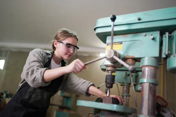 stock image Young beautiful woman doing work in the carpenter DIY workshop room. Small Business owner, young woman who working at furniture factory.