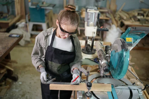 stock image Small business of young woman. Beautiful young woman worker in a furniture workroom