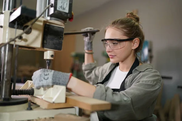 stock image Small business of a young woman. Beautiful young woman worker in a furniture workroom