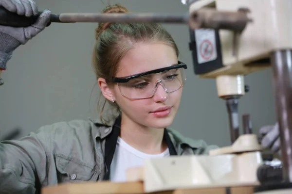 stock image Small business of a young woman. Beautiful young woman worker in a furniture workroom