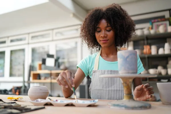 stock image Young Afro girl in pottery workshop, Business owner