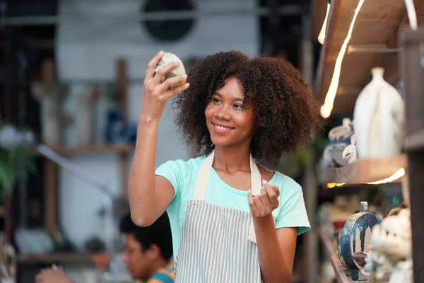 stock image Young Afro girl in pottery workshop, Business owner