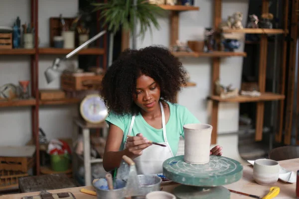 stock image Portrait of a creative potter artisrt or business owner with ceramic products at the pottery shop