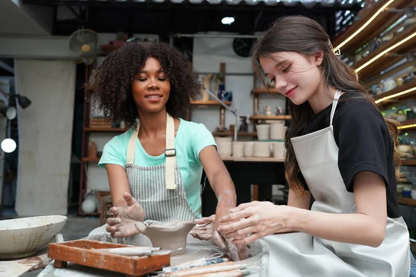 stock image Young girls in pottery workshop, Business owner. 