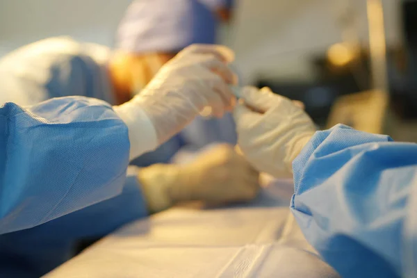 Stock image surgeons working inside operating room 