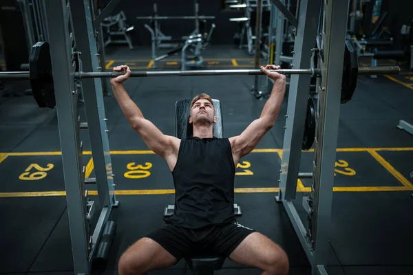 stock image Male athlete exercising in the gym