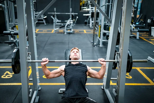 Male athlete exercising in the gym