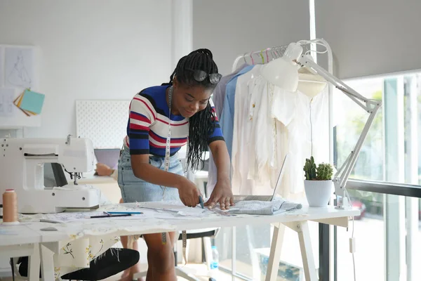 young clothes designer in her studio